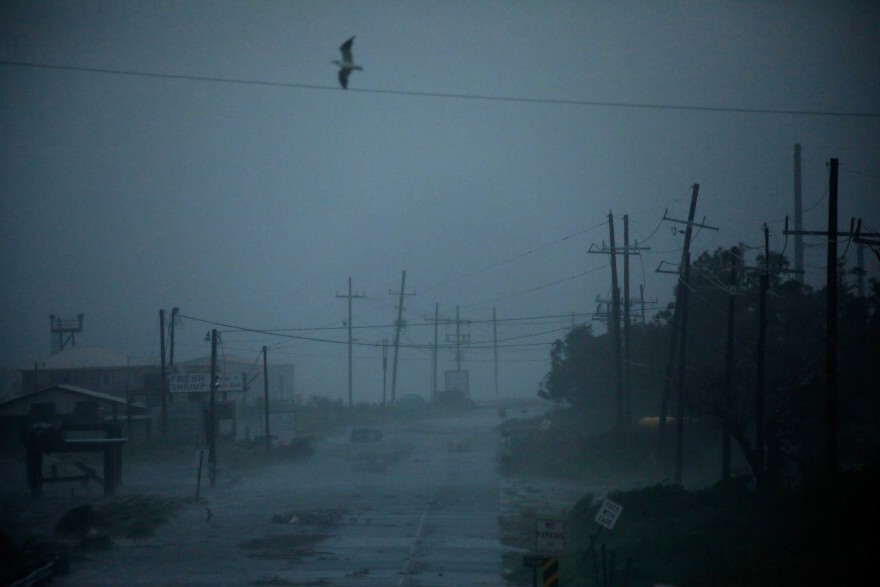 Heavy rain falls as storm surge begins to encroach on Louisiana Route 1 ahead of Hurricane Ida in Golden Meadow, Louisiana, U.S., on Sunday, Aug. 29.