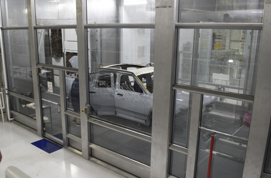  A Rivian R1T electric pickup moves through the Paint Shop on Tuesday, April 12, 2022, in Normal.