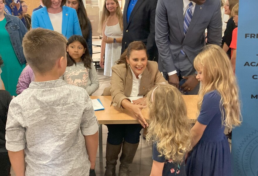 Michigan Governor Gretchen Whitmer greets students at a ceremony in Suttons Bay to sign a $25.3 billion school funding bill for the coming fiscal year. 