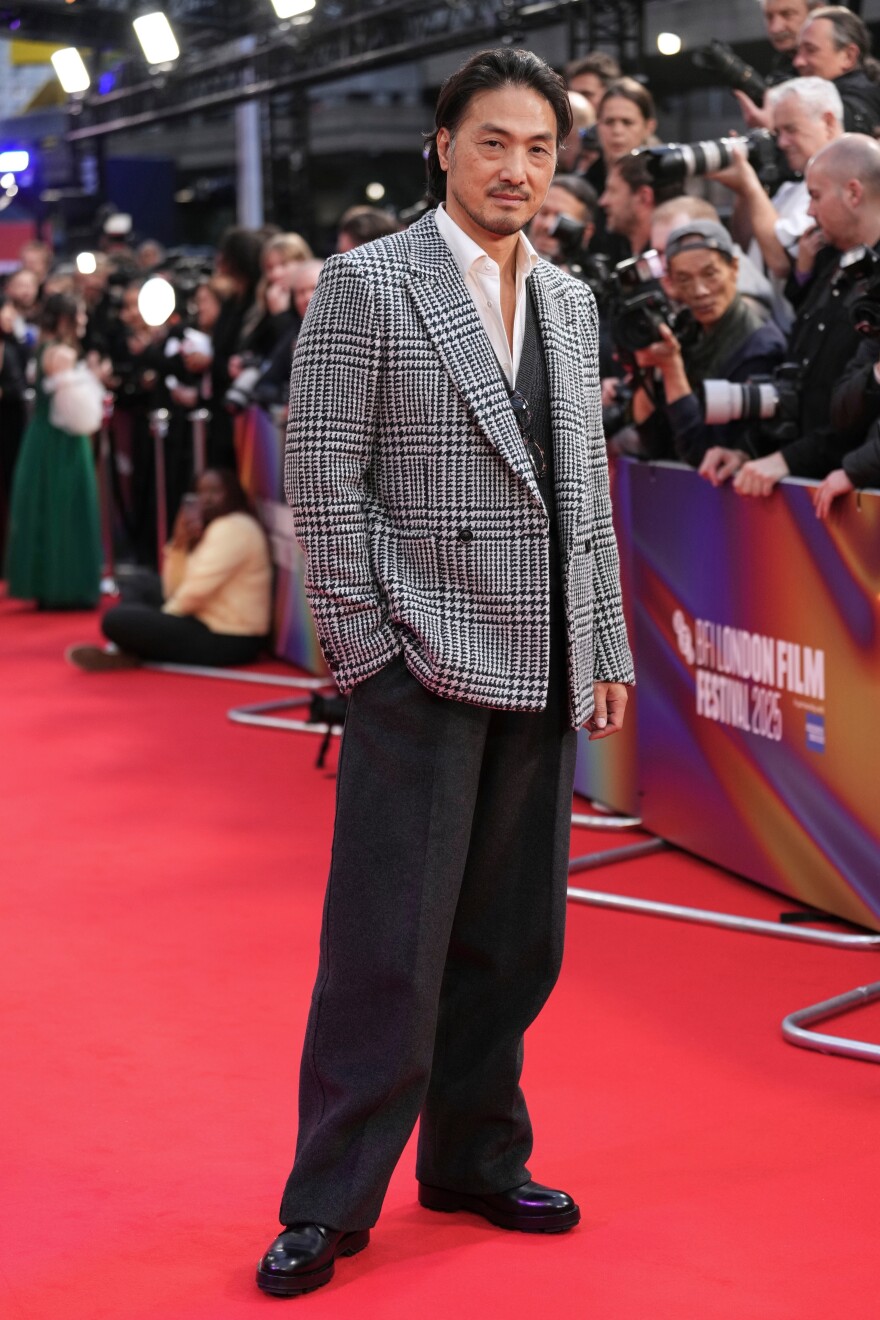 Takehiro Hira poses for photographers upon arrival at the premiere of the film "Rental Family" during the London film festival in London, Thursday, Oct. 16, 2025.