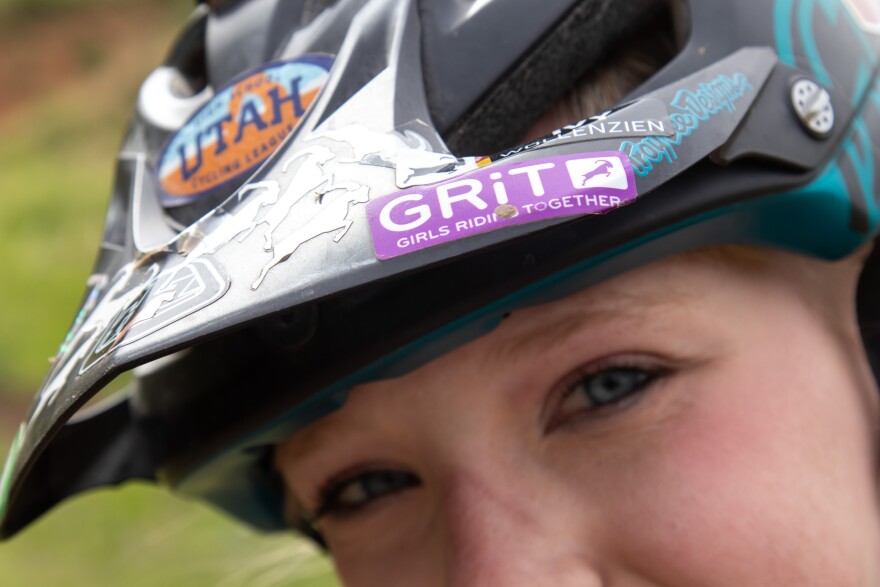 Ivy Wollenzien shows off the GRiT sticker on her helmet.