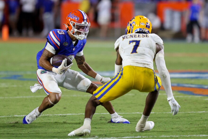 University of Florida’s Eugene Wilson III (#3) attempts to get past McNeese State’s Johnquai Lewis (#7) during the Gators' game against McNeese State at Ben Hill Griffin Stadium in Gainesville, Fla., Saturday night, Sept. 9, 2023. The Gators beat McNeese State 49-7. (Ethan Goddard/WUFT News)