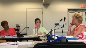 Charter Review member Susan Bottcher speaks to fellow member Cynthia Chestnut, left, and chairwoman Mary Lou Hildreth, right, during the group’s third meeting. (Danielle Ivanov/WUFT News)