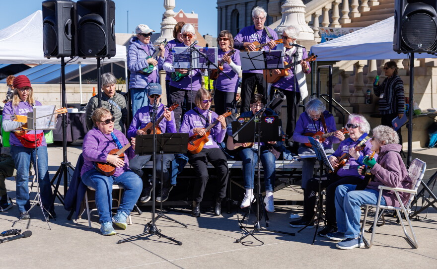 The MI Vote Strummers perform in Lansing, Mich., on Oct. 17, 2026, during the fourth No Kings rally.