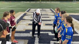 Captains from Orchard Park and Kenmore meet for the Coin Toss ahead of the girls flag football 2025 Class A Section VI Championship.