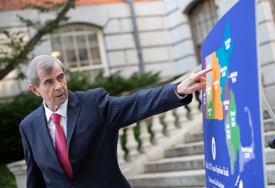 Massachusetts Secretary of State William Galvin gestures to a county-level map showing the 2020 census results.