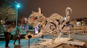 An illuminated cat sculpture in downtown Reykjavik on November 29, 2021. Icelandic folklore tells of a giant cat that eats children who don't wear their new clothes at Christmas time.