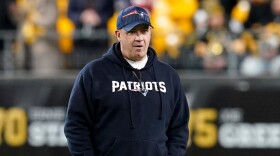 New England Patriots offensive coordinator Bill O'Brien watches warmups prior to a game.