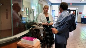 Jenniffer Mullen talks with her attorney at the Steuben County courthouse after her hearing where she pleaded guilty to a felony.