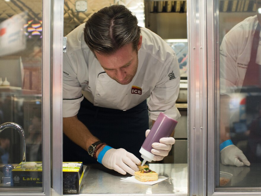 At the IBM food truck, chef James Briscione serves up Baltic apple pie — a dish that includes pork loin, apples and garlic chips.