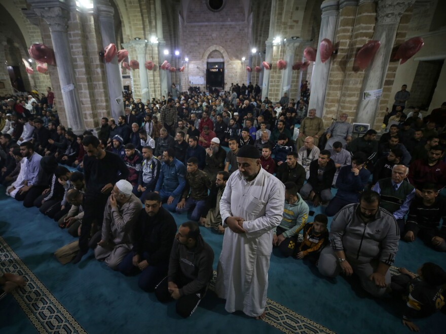 Palestinian devotees pray on Laylat al-Qadr at the Omari mosque during the Muslim holy month of Ramadan in Gaza City, on April 17, 2023.