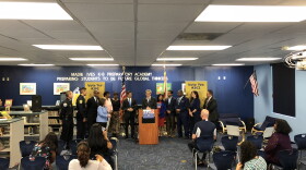 Tony Argiz, chair of a political action committee supporting the teacher pay referendum, begins a news conference at Madie Ives K-8 Center near Aventura on Tuesday morning. Miami-Dade County schools superintendent Alberto Carvalho looks on.
