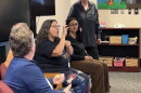 Kristen Sickler, Rochester School for the Deaf alumna and author of the book Siren of the Finger Lakes, presents at an alumni panel discussion with current students at the school's library on Friday.
