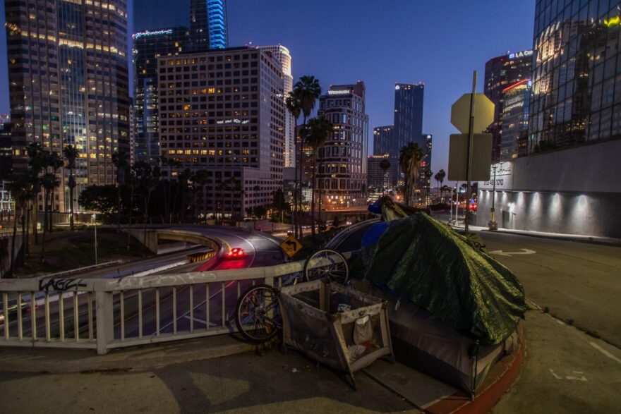 A homeless tent is seen at dusk next to the 110 Freeway, during the novel Coronavirus, COVID-19, pandemic in Los Angeles California.