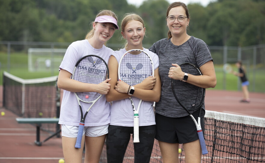 Cara and Anna Evans and their mom, Teri Evans, enjoy their time on the court together.