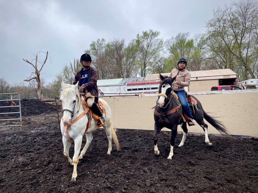 Tyler de Leon (left) is riding Alejandra Piña's horse Julio during one practice. de Leon is the youngest on the team, but after a successful tryout, de Leon was quickly added to Escaramuza Charra Quetzalli's roster. de Leon acknowledged the sporting event is all-women: "I'm proud to be the first person [male]. I'm proud to advocate and not be scared. And part of that is my team, I wouldn't be at the point [where] I am, of being open, if it weren't for them," de Leon said.