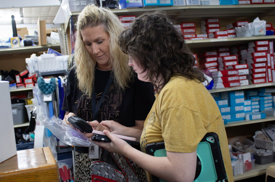 Marci Bacon looks over supplies at the Wichita Medical Loan Closet with her daughter Morgan.