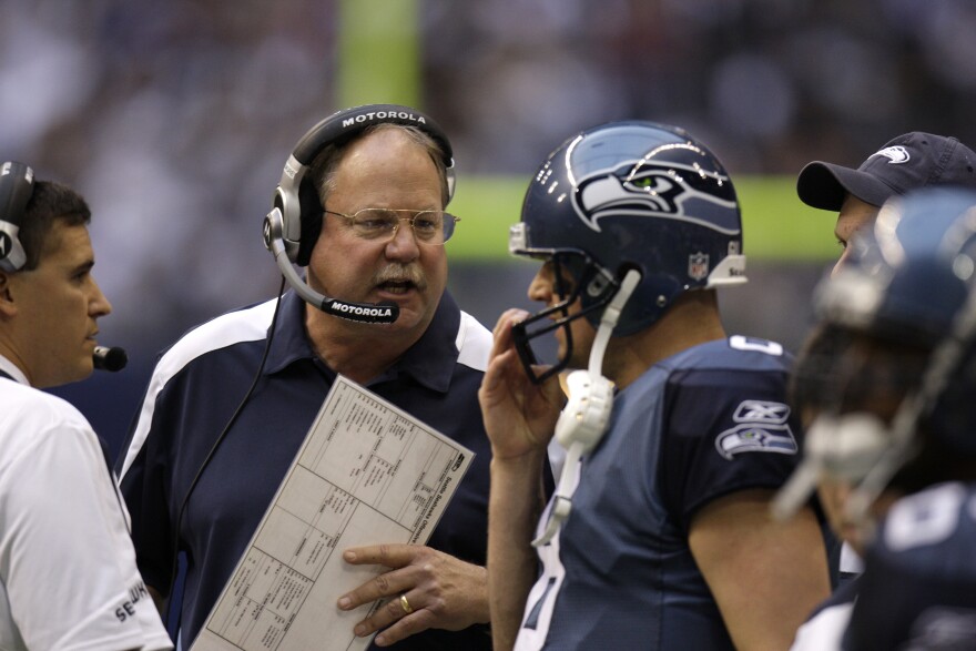 Seattle Seahawks head coach Mike Holmgren, left, talks with quarterback Matt Hasselbeck during an NFL football game against the Dallas Cowboys on Nov. 27, 2008, in Irving, Texas.