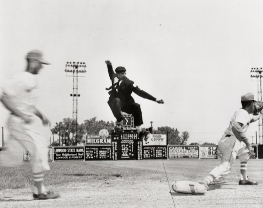 Negro League baseball umpire Bob Motley in the air.