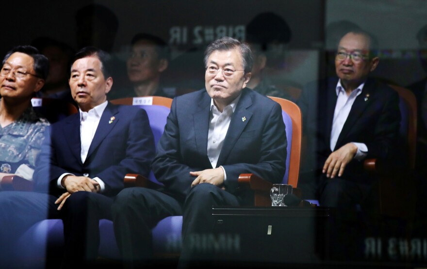 South Korean President Moon Jae-in watches a test-firing of an indigenously developed ballistic missile at the state-run Agency for Defense Development in Taean, South Korea.