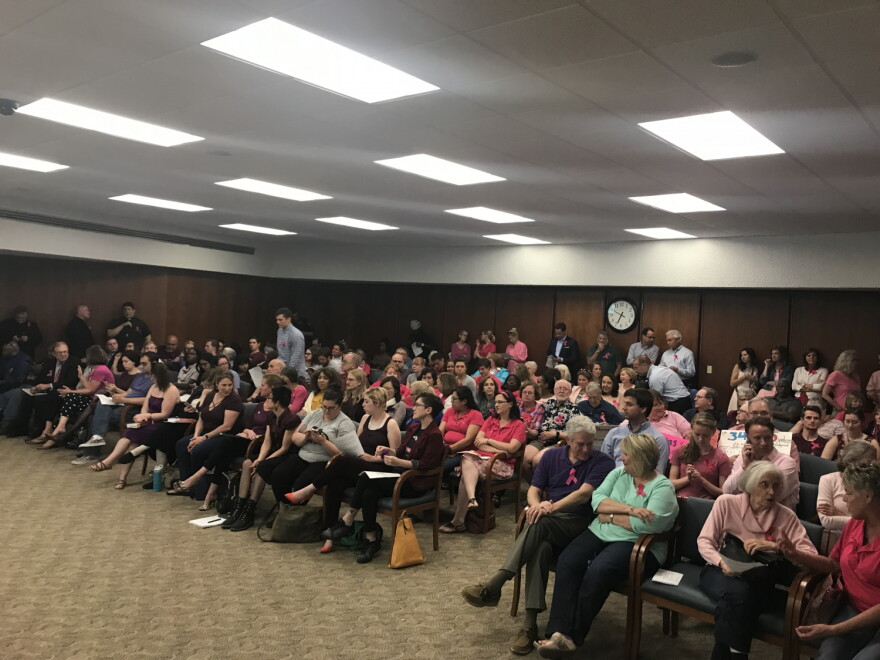 Pro-life and pro-choice supporters wait for the South Bend Common Council meeting to begin on Monday.