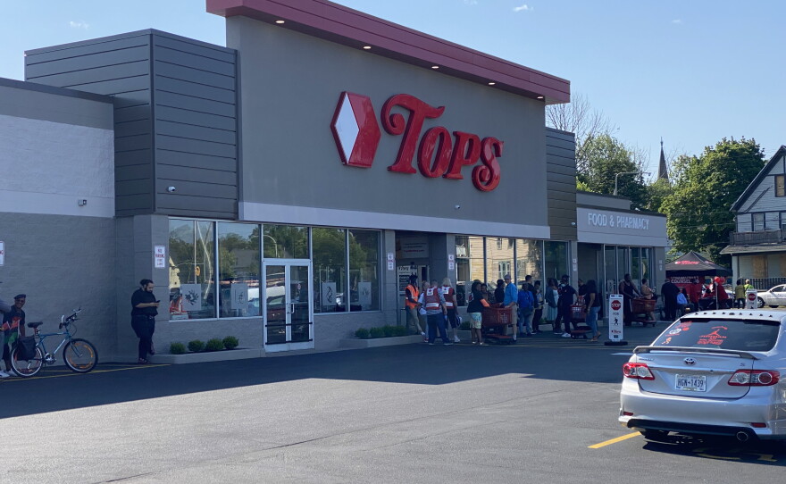 Shoppers enter Tops Markets on Jefferson Avenue