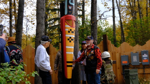 The chief of the Valdez Native Tribe Bill Smith (right) and other veterans unveil a new monument at the Alaska Native Heritage Center’s Ngíisdla Garden on Sunday, Sept. 27.