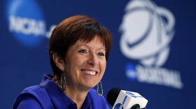 FILE - In this March 27, 2015, file photo, Notre Dame head coach Muffet McGraw listens during a news conference after a women's college basketball regional semifinal game against against Stanford in the NCAA Tournament in Oklahoma City.
