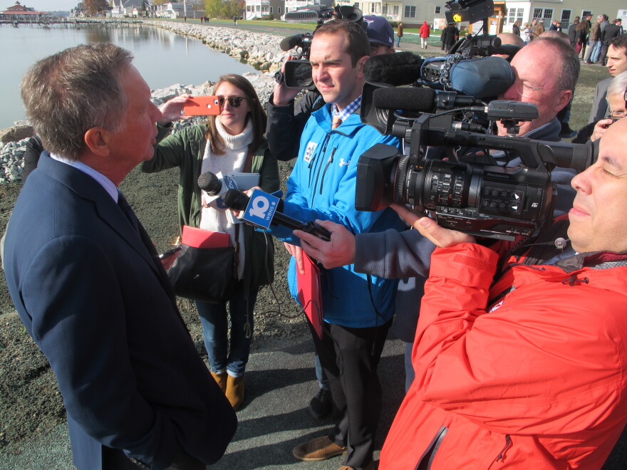 Gov. John Kasich talking to journalists after opening the newly reinforced dam at Buckeye Lake. 