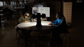 Voters take to the polls during the General Election on Tuesday, Nov. 5, 2024, at Holy Name Community Center in Bellefontaine Neighbors, Mo. A power outage at the polling site caused staff to run off of lanterns and generators.