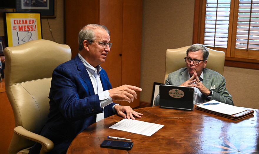 Georges sits at a conference table alongside William "Bill" Kearney, his longtime friend and business partner, in his office at Imperial Trading Company. Georges believes AI licensing contracts "will save journalism," and he has been chasing an AI contract for more than a year.