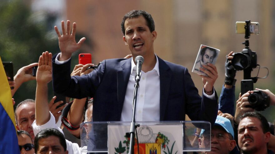 Juan Guaidó, head of Venezuela's opposition-run congress, declares himself interim president of Venezuela during a rally against President Nicolás Maduro in Caracas on Wednes