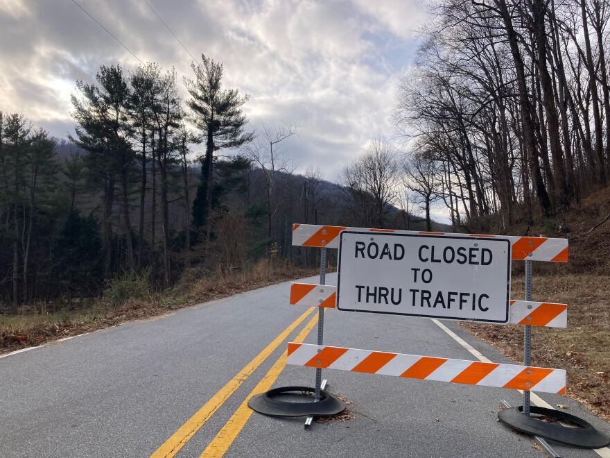 A sign declares the closure of U.S. 176 in Polk County.