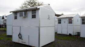 Two pallet homes seen on Nov. 20, 2025 that previously housed Sandbox residents now sit empty after the site lost state funding.
