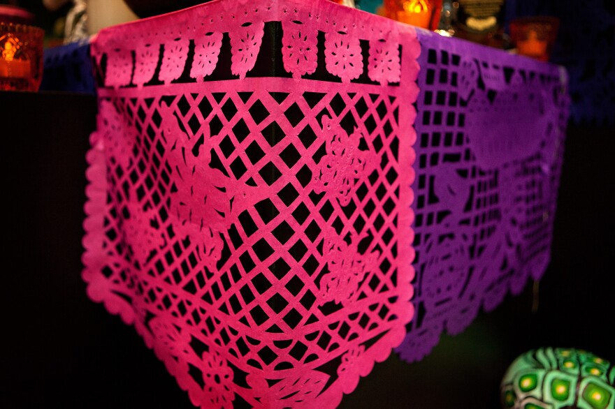 Papel picado: Delicately decorated tissue paper is used to represent wind and the fragility of life.
