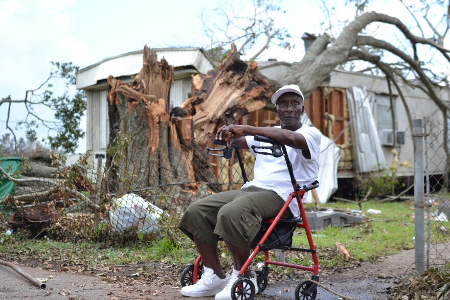 Melvin Ceaser, 82, said his father planted the live oak tree behind him, which crushed a neighbor’s trailer back when he was a child. His home was damaged too, and it’s been in his family for generations.