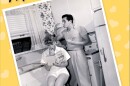 A yellow book cover has black and red writing and a black-and-white photo of a woman reading a book while sitting on a stool in a kitchen and a man stands behind her drinking a beverage.