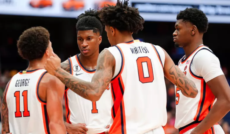 Naithan George (11, White), Sadiq White (0, White), Tyler Betsey (5, White), Donnie Freeman (1, White) huddled together