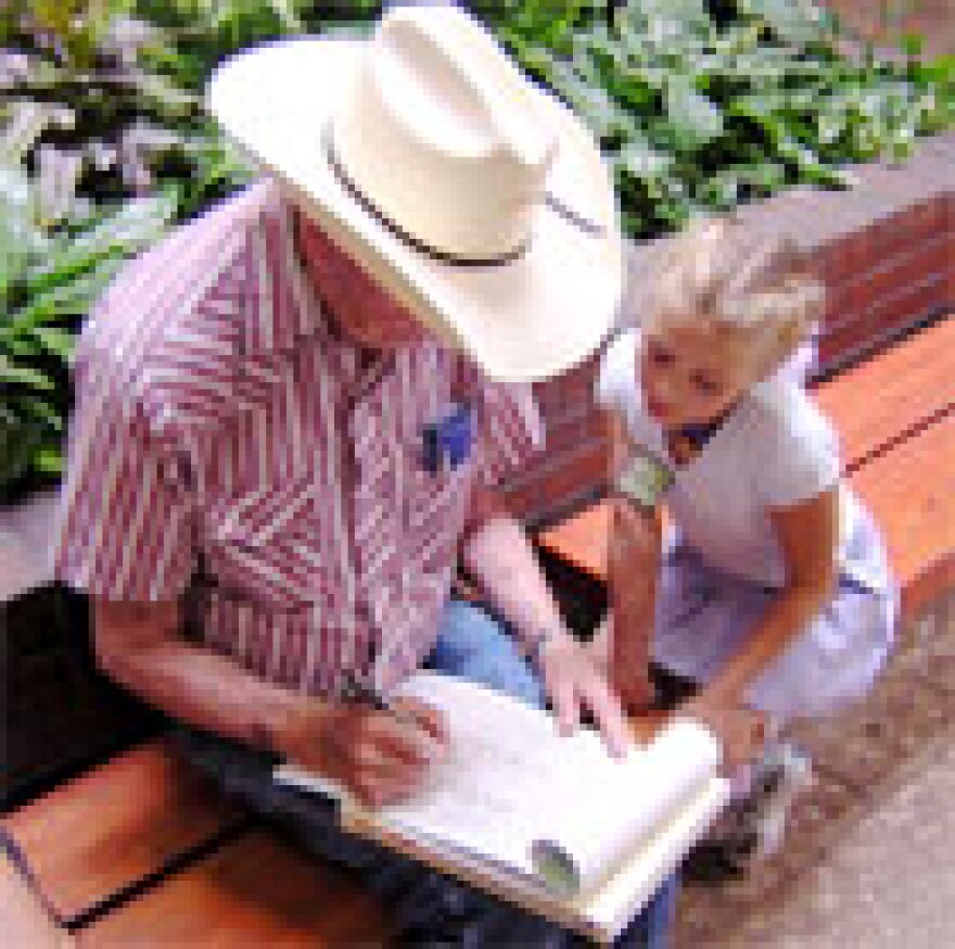 Lily Thorpe gets a signature for her petition seeking an increase in the tobacco tax.