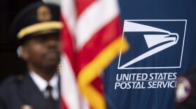 A U.S. Postal Service police honor guard member stands at attention during the service's 250th anniversary ceremony, Wednesday, July 23, 2025, in Washington. (AP Photo/Cliff Owen)