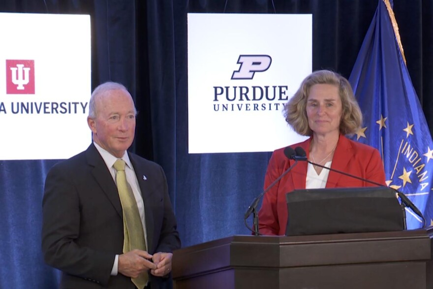 Purdue president Mitch Daniels (left) and Indiana University president Pamela Whitten (right) at Friday's announcement in Indianapolis.