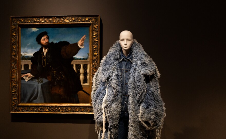 A cotton ensemble by Diesel from the fall/winter 2022 season includes a fluffy, eye-catching men’s coat of shredded denim, whose silhouette echoes the coat worn by the subject of a 16th century portrait by Lorenzo Lotto.