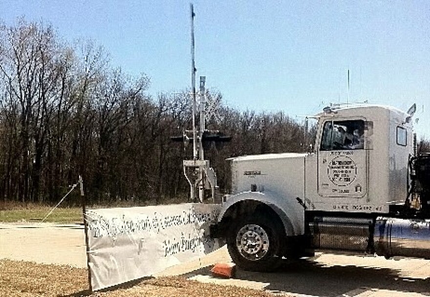A tractor trailer rig slams into the barricade