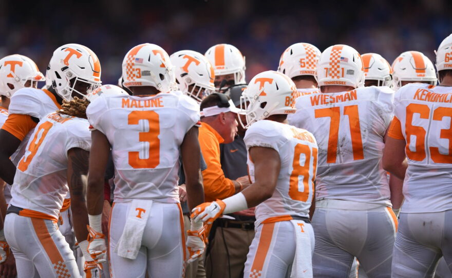 Tennessee coach Butch Jones talks with his team during a time out.