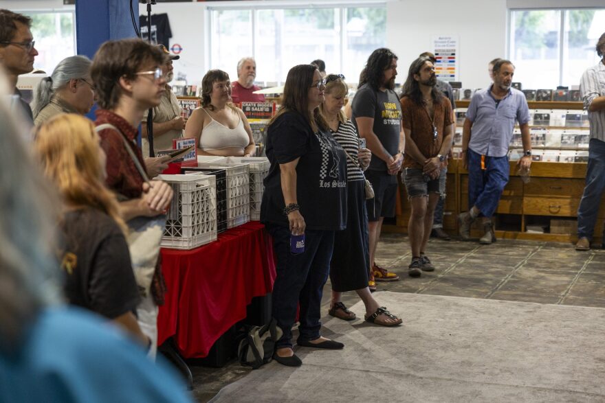 People watch as Cast Iron Shoes performs.