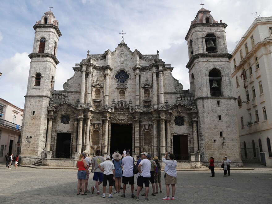 American tourists, like these visitors taking a guided tour in May, still have to provide one of 12 authorized reasons — such as visiting family or engaging in humanitarian work — for travel to Cuba.