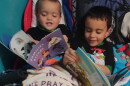 Ashley McNair's sons Kenny Jr., then 3, and Matteo, then 5, read books they received from the Rochester Imagination Library in this 2022 file photo.