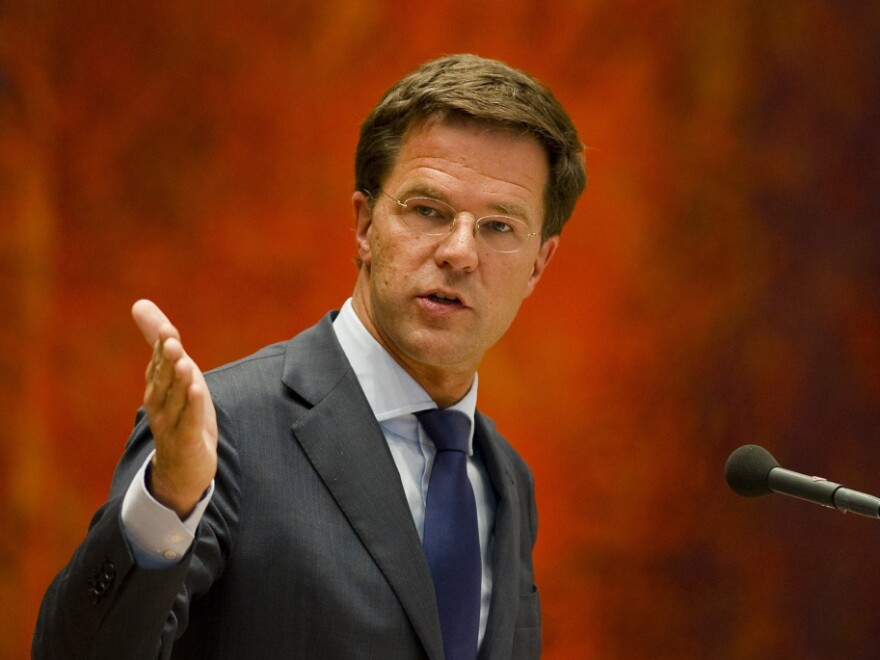 Dutch Prime Minister Mark Rutte, shown here speaking in Parliament on Tuesday, resigned a day earlier over a budget crisis.