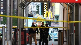 Police officers are seen next to marked shell casings from a gun in Times Square on May 8, 2021 in New York City. According to reports, three people, including a toddler, were injured in the shooting. (David Dee Delgado/Getty Images)