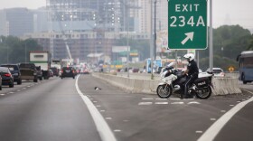 An Austin Police officer on a motorcycle on I-35 near downtown Austin on May 10, 2016.